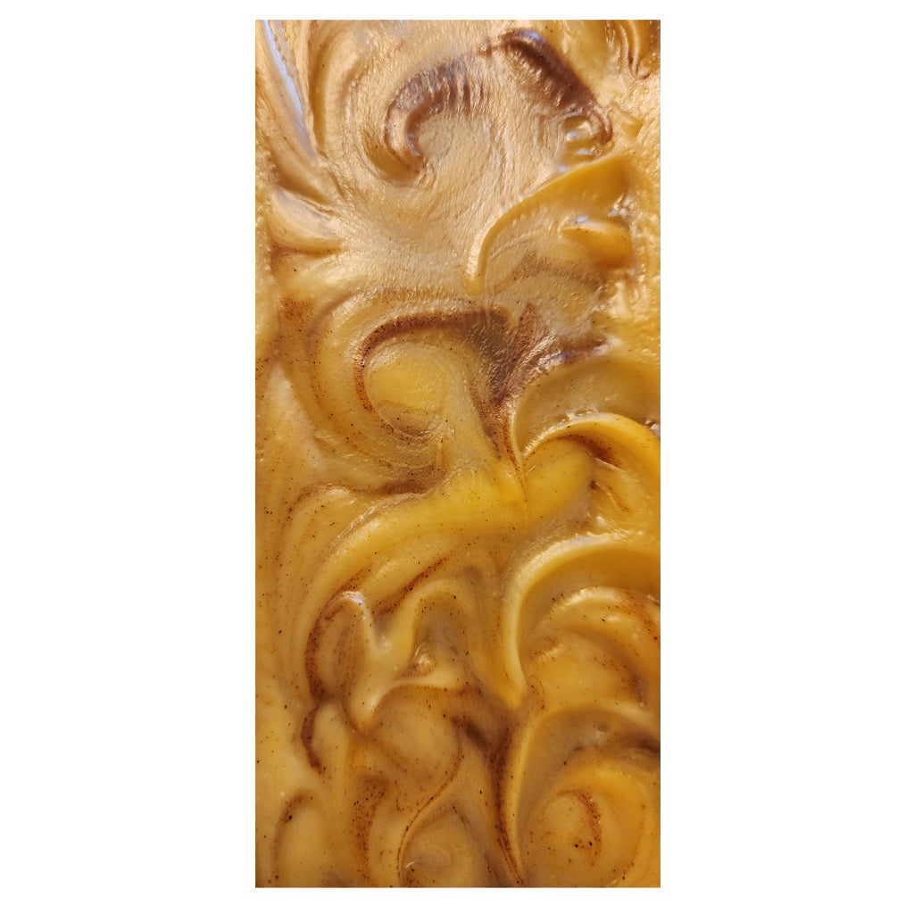 organic shea butter bar soap scented with natural essential oils of lemongrass and turmeric, infused with turmeric powder, made with certified organic oils and shea butter, cold processed, hand poured, hand cut, handcrafted in the USA, aromatherapeutic organic bar soap, picture of top of log of soap